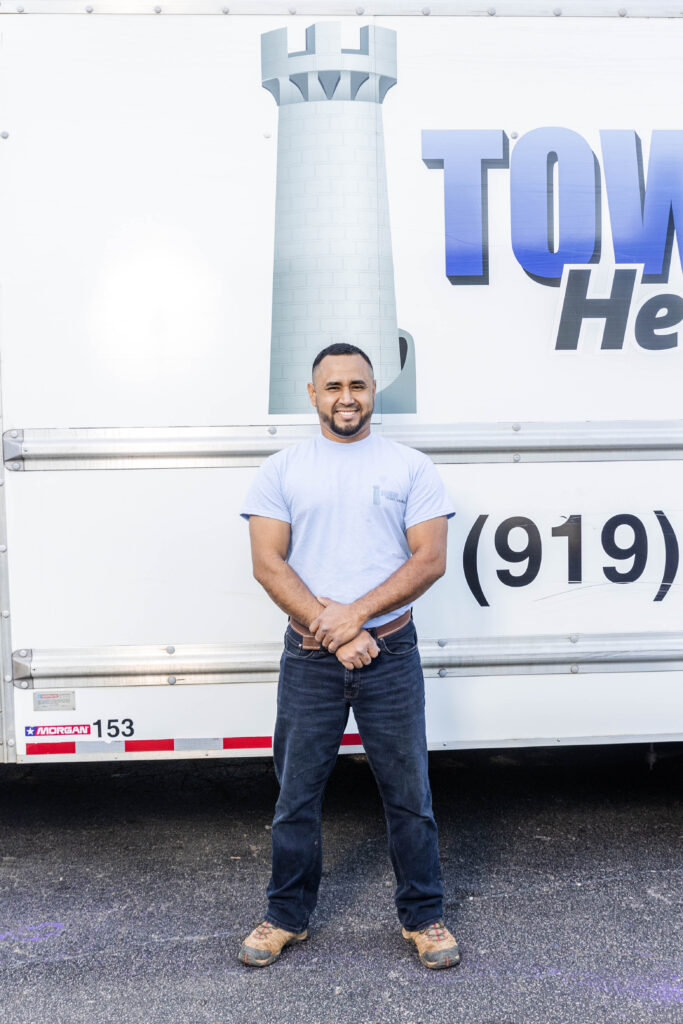 Tower Heating and Air cooling repair employee picture standing in front of Cary AC repair and replacement truck