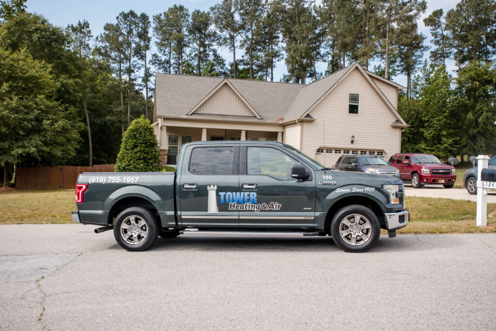Tower Heating and Air Backflow Services Truck Parked Outside a Durham Area Home reviews